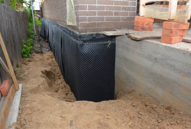 Happy homeowners after waterproofing job in Oakwood